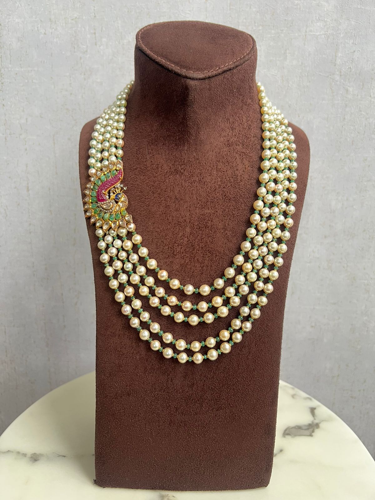Unisex pearl mala with peacock side pendant Unisex pearl mala with peacock side pendant